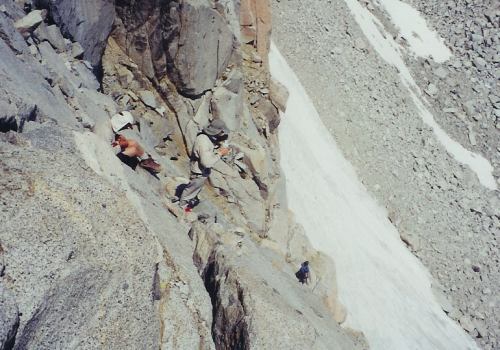 Foo'ball (intent on something), Jim and Tad making their way across the north face of Darwin's west ridge.