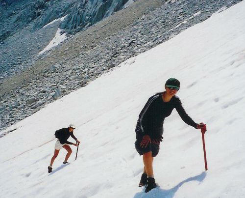 Maria and Tasha slog their way up the snow to the Royce - Merriam saddle.