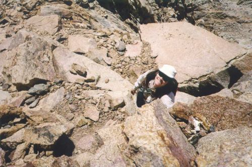 Kathy scrambling up Mt. Humphreys for the second time in two years.