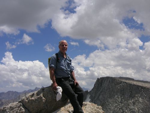 Dan on the summit of Mt. Mendel with Darwin the background